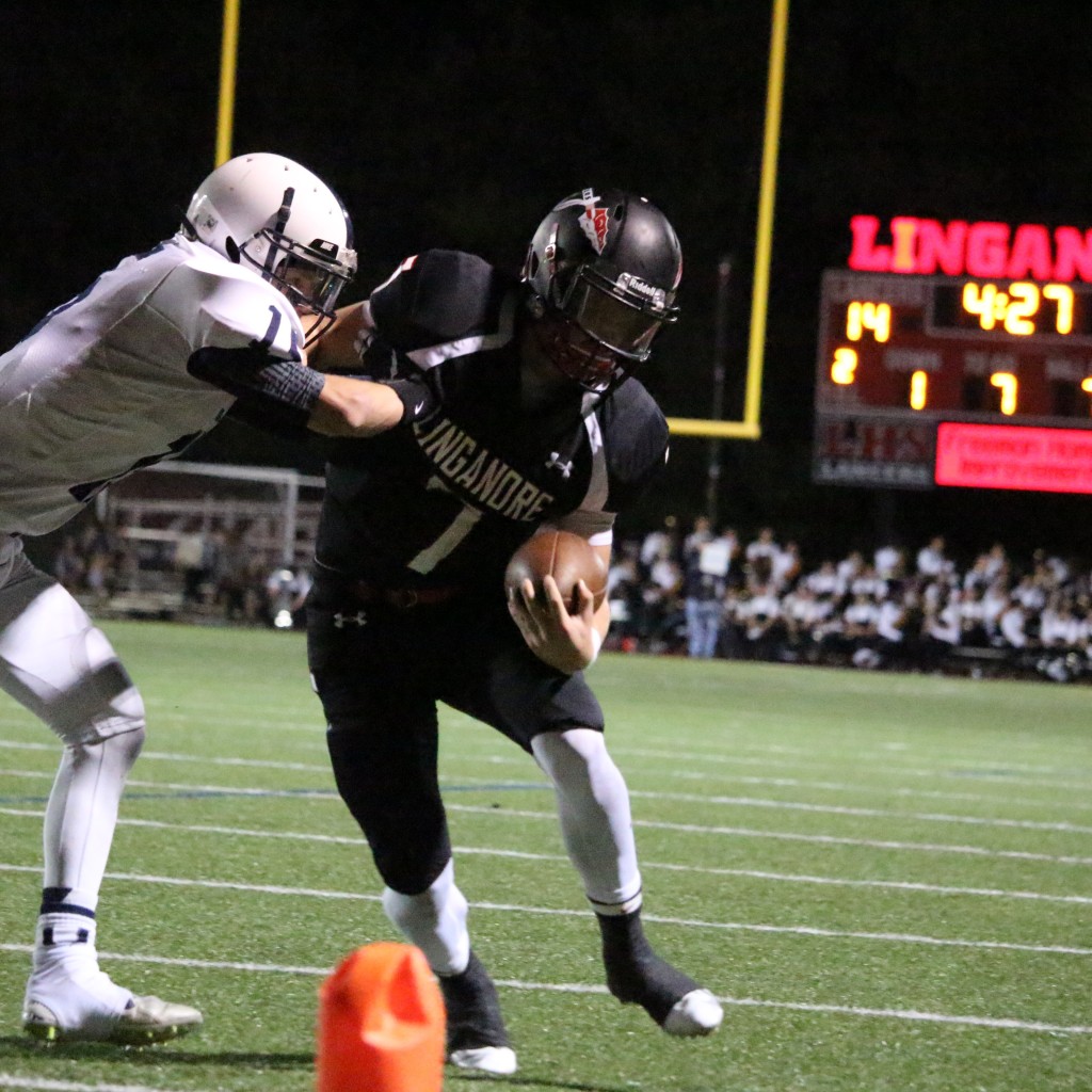 Nathaniel Musselman (7) gets forced out of bounds by Urbana's Parker Mellott. Photo taken by Austin McFadden.