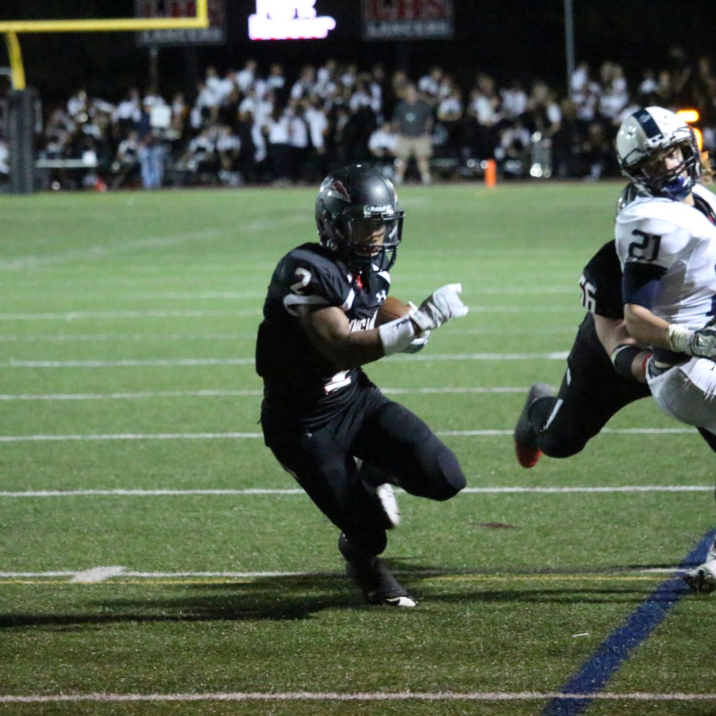 Davon Butler knifes through the Urbana defense for the 7-yard score. Photo taken by Austin McFadden.